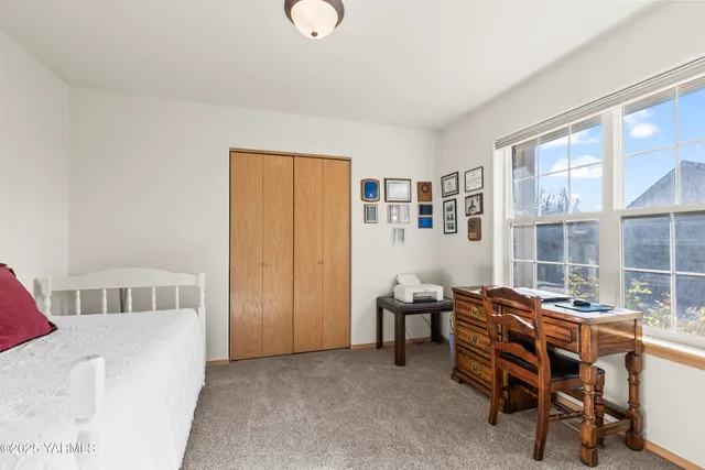 a workspace with furniture and a window