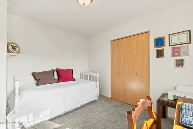 a bedroom with a bed and furniture