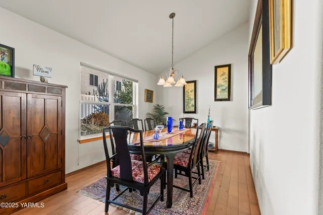 a view of a dining room with furniture and window