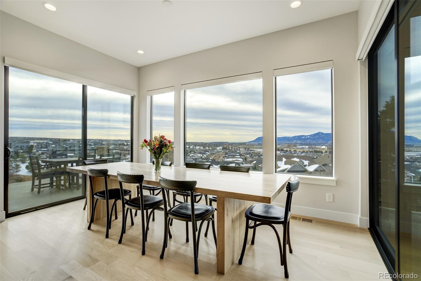 1287 Kelso Place Colorado Springs, CO 80921 - Photo 13 of 50 a dining room with furniture water view and a floor to ceiling window
