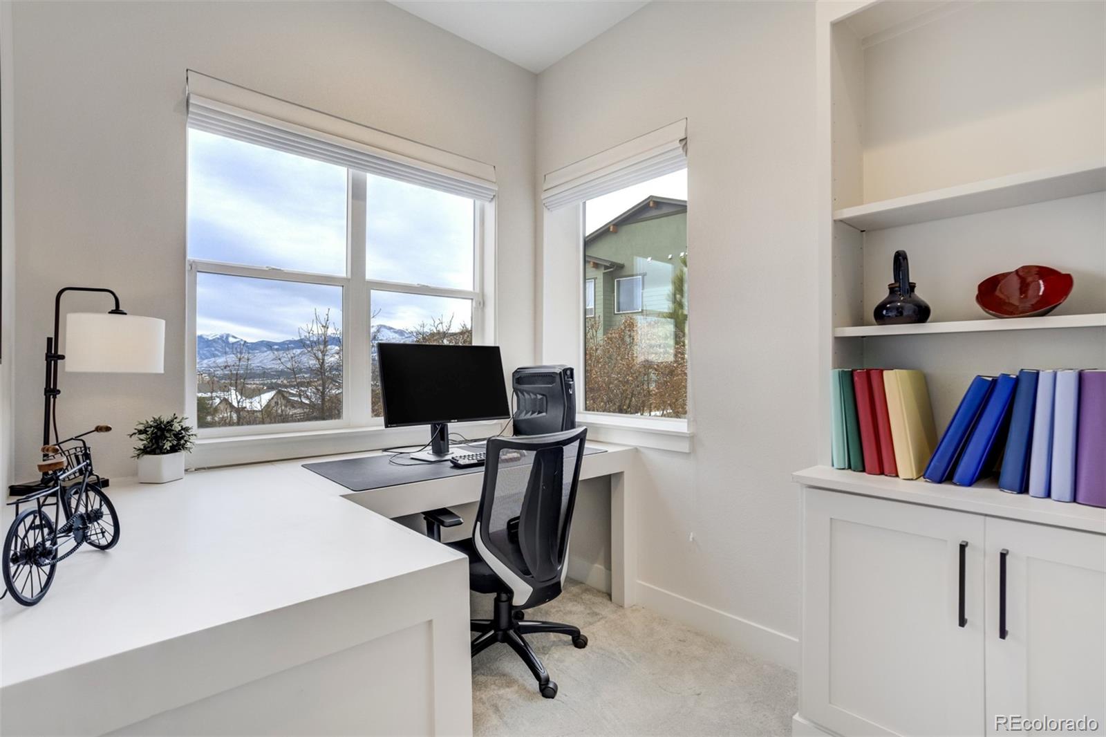 1287 Kelso Place Colorado Springs, CO 80921 - Photo 24 of 50 a view of a workspace with furniture and a window