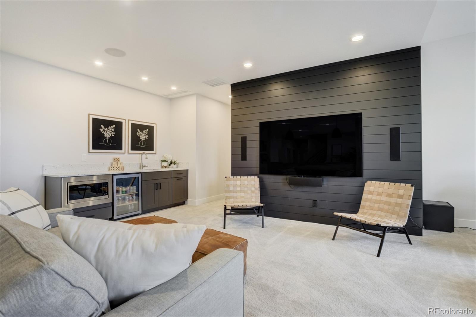 1287 Kelso Place Colorado Springs, CO 80921 - Photo 26 of 50 a living room with furniture and a flat screen tv