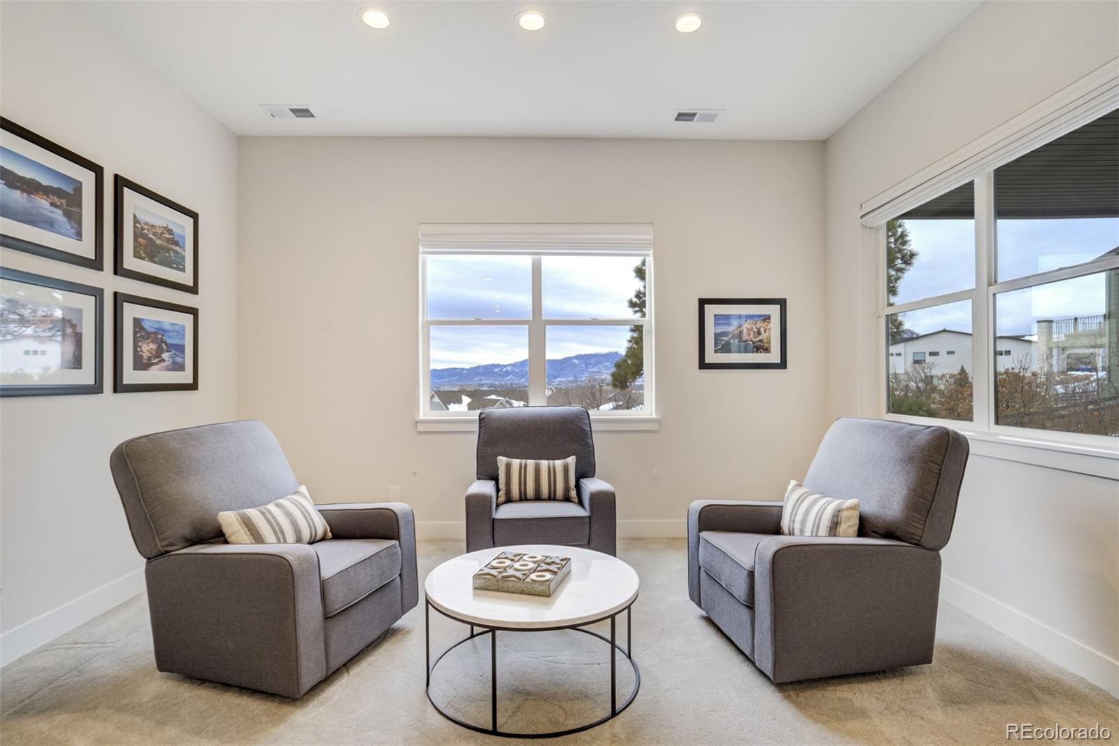 1287 Kelso Place Colorado Springs, CO 80921 - Photo 27 of 50 a living room with furniture and a large window
