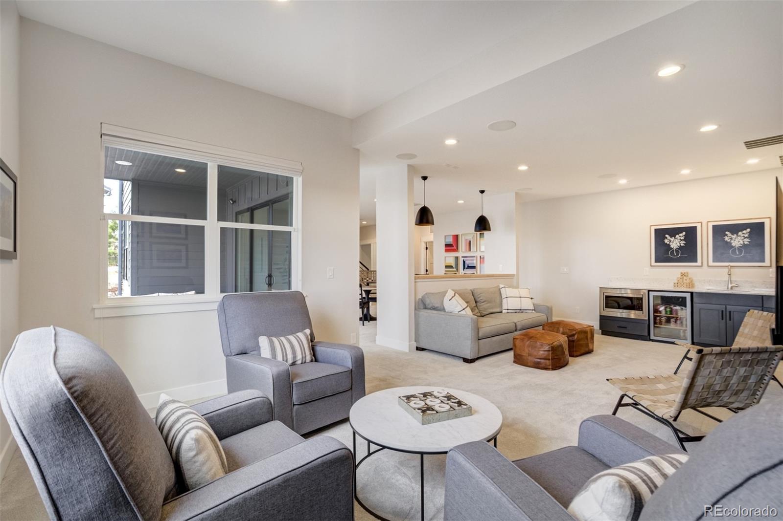 1287 Kelso Place Colorado Springs, CO 80921 - Photo 28 of 50 a living room with furniture and a large window