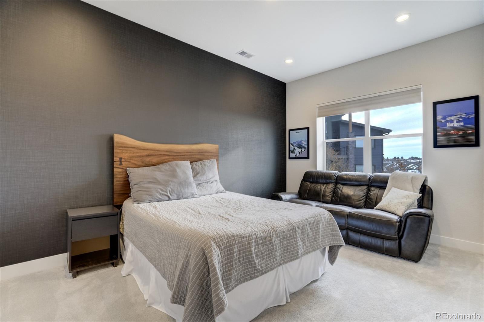 1287 Kelso Place Colorado Springs, CO 80921 - Photo 33 of 50 a bedroom with a bed couch and window