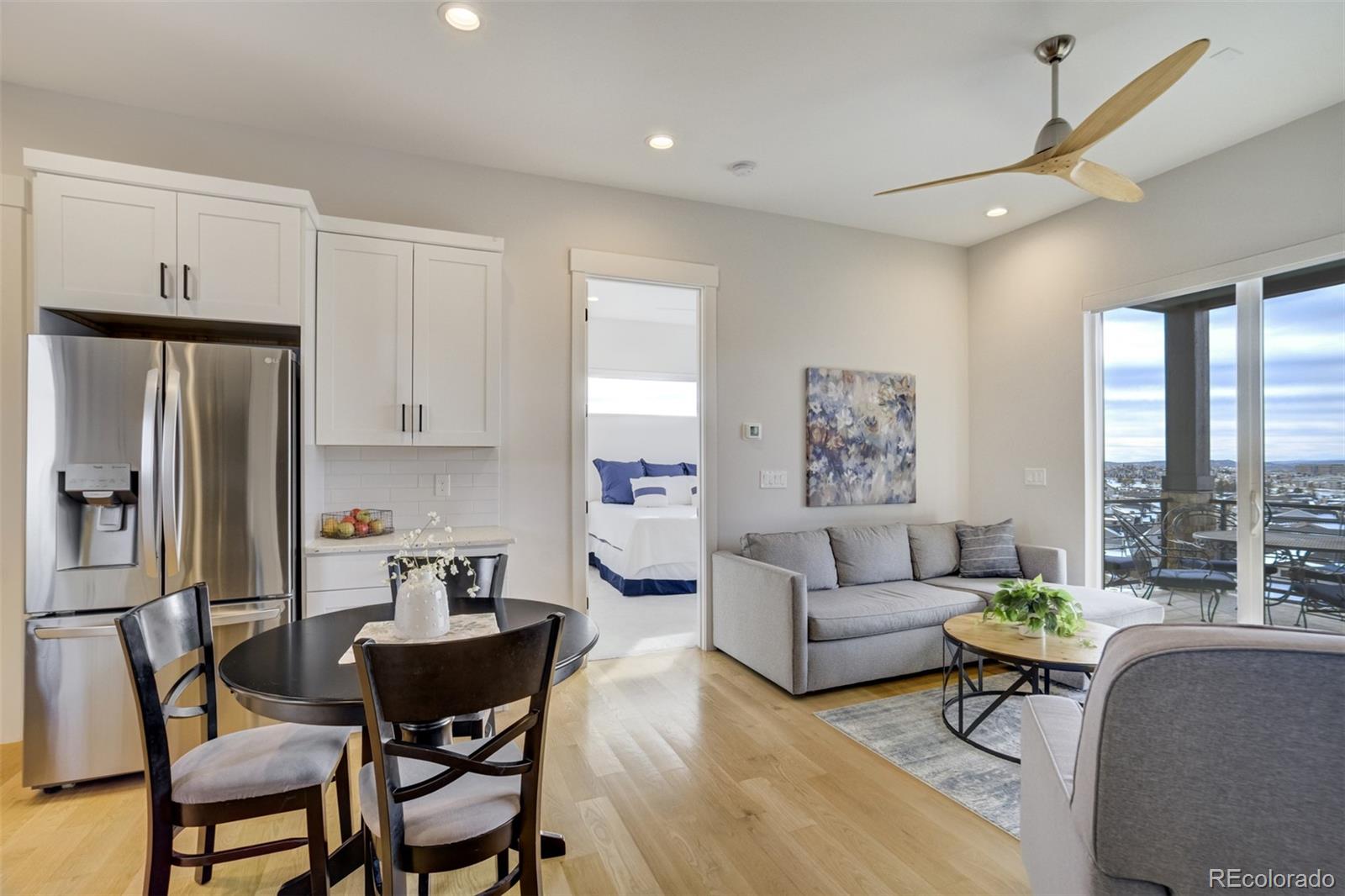 1287 Kelso Place Colorado Springs, CO 80921 - Photo 39 of 50 a living room with furniture and a large window