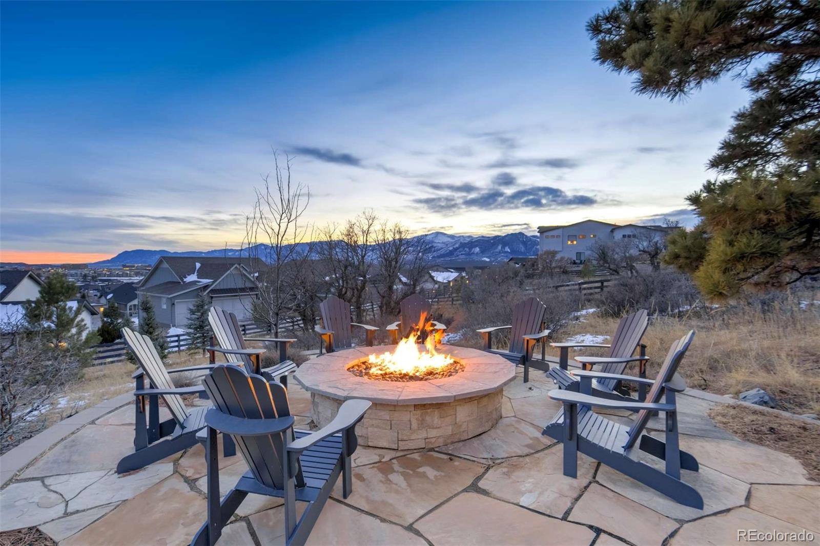 1287 Kelso Place Colorado Springs, CO 80921 - Photo 45 of 50 a view of a lounge chair and fire pit