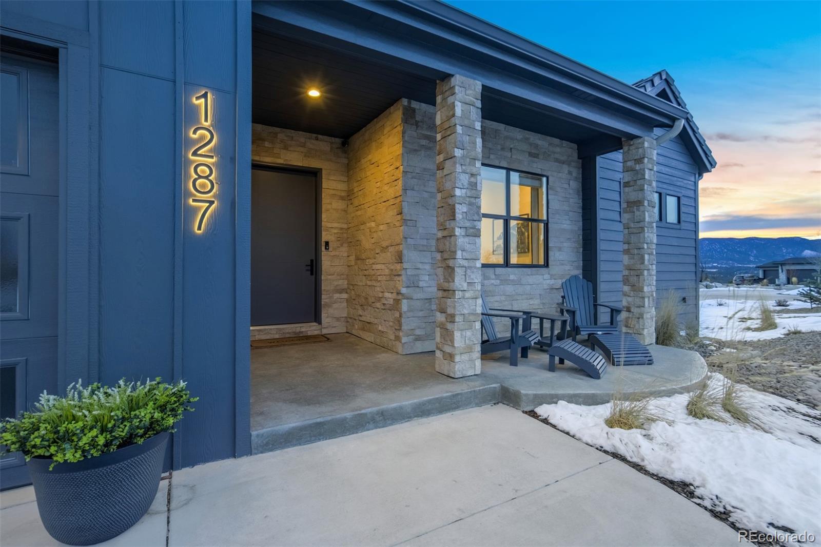 1287 Kelso Place Colorado Springs, CO 80921 - Photo 50 of 50 a front view of a house with outdoor seating