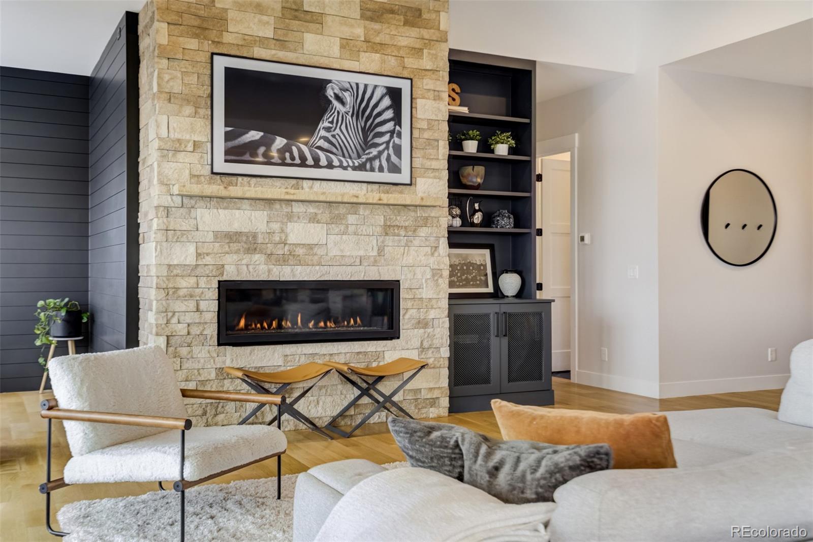1287 Kelso Place Colorado Springs, CO 80921 - Photo 6 of 50 a living room with furniture and a fireplace