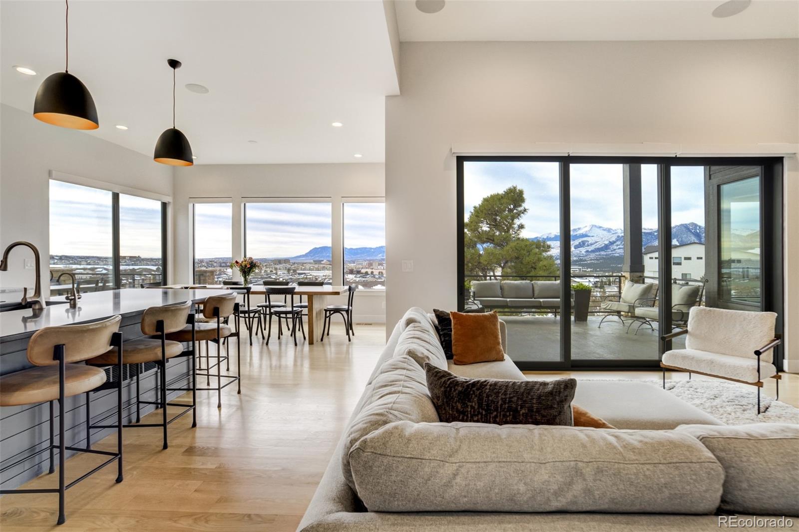 1287 Kelso Place Colorado Springs, CO 80921 - Photo 8 of 50 a living room with furniture and large windows