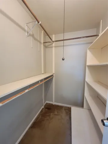 a view of a room with racks on the wall