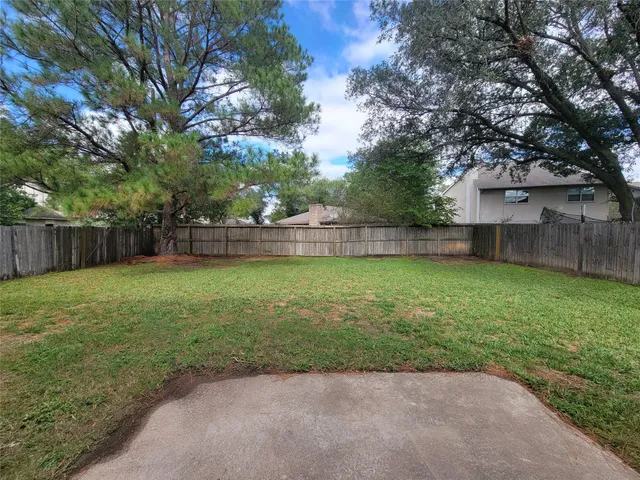 a backyard of a house with lots of green space