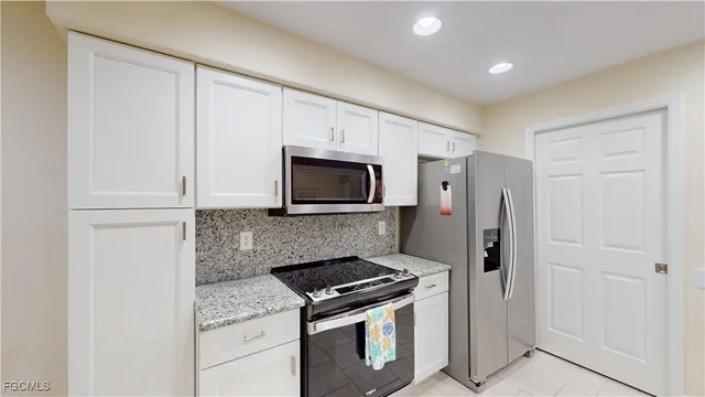 a kitchen with a stove microwave and refrigerator