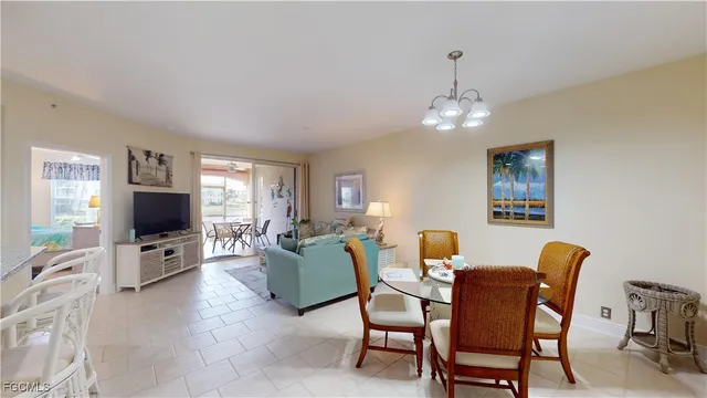 a view of a livingroom with furniture and a flat screen tv