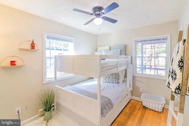 a spacious bedroom with a bed and a table