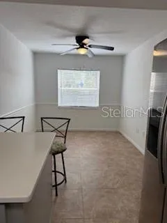 a view of a hallway with paintings on the wall