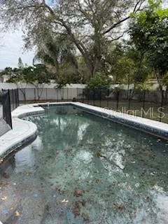 a view of a swimming pool with a lake view