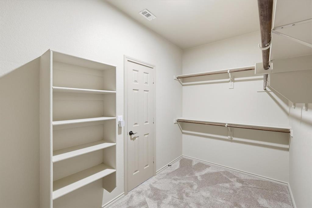 3228 Buckthorn Lane Argyle, TX 76226 - Photo 18 of 21 a view of an empty walk in closet