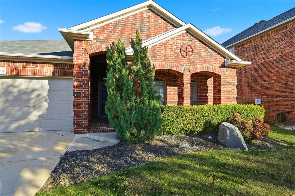 3228 Buckthorn Lane Argyle, TX 76226 - Photo 2 of 21 a front view of a house with garden