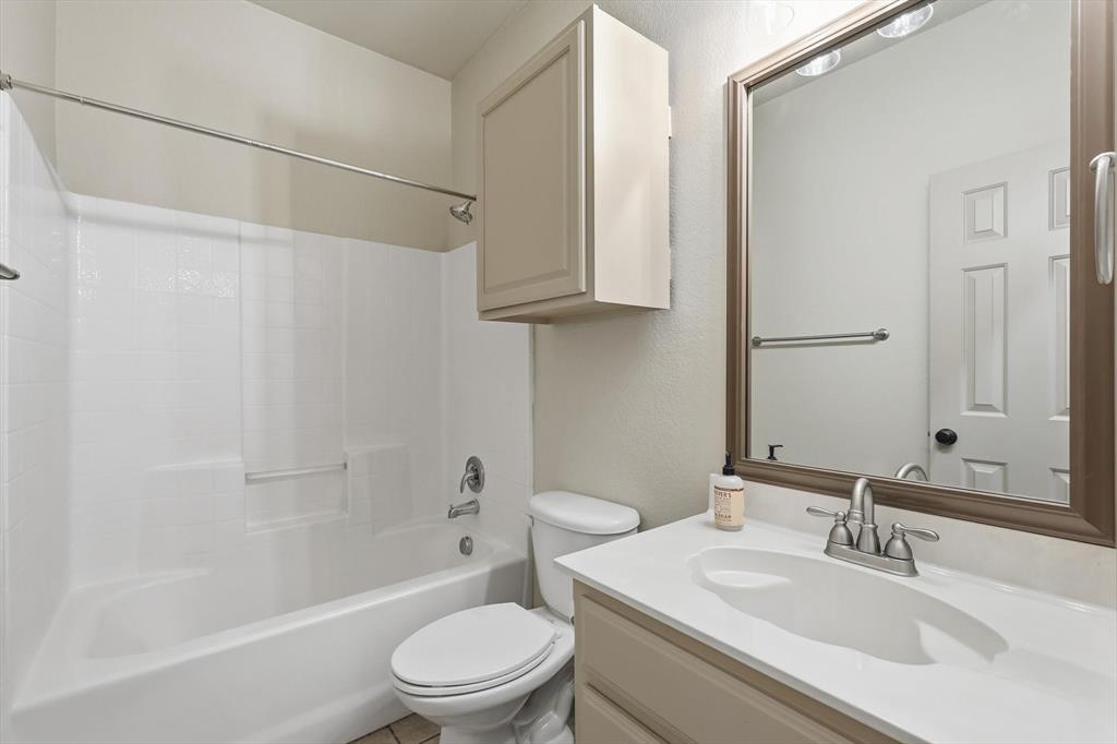3228 Buckthorn Lane Argyle, TX 76226 - Photo 6 of 21 a bathroom with a sink a toilet and shower