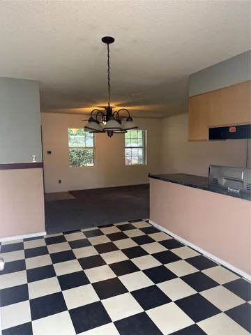 a black and white checkered floor with a black white checkered floor