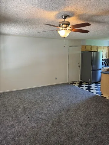 a view of a room with a fan