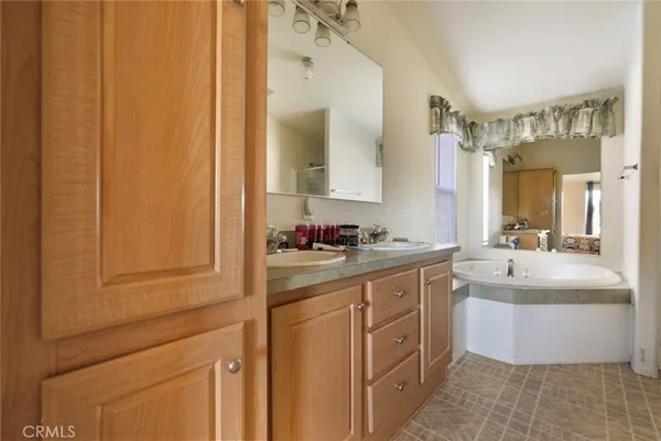 a bathroom with a double vanity sink mirror and