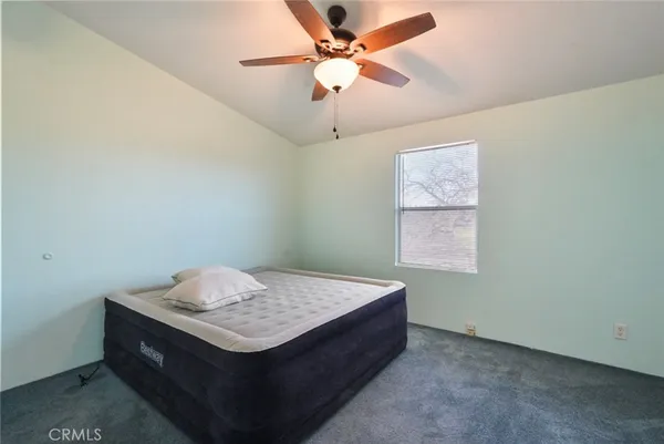 a room with table and ceiling fan