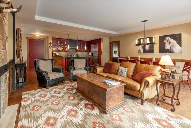 a bedroom with a bed lamps and fireplace