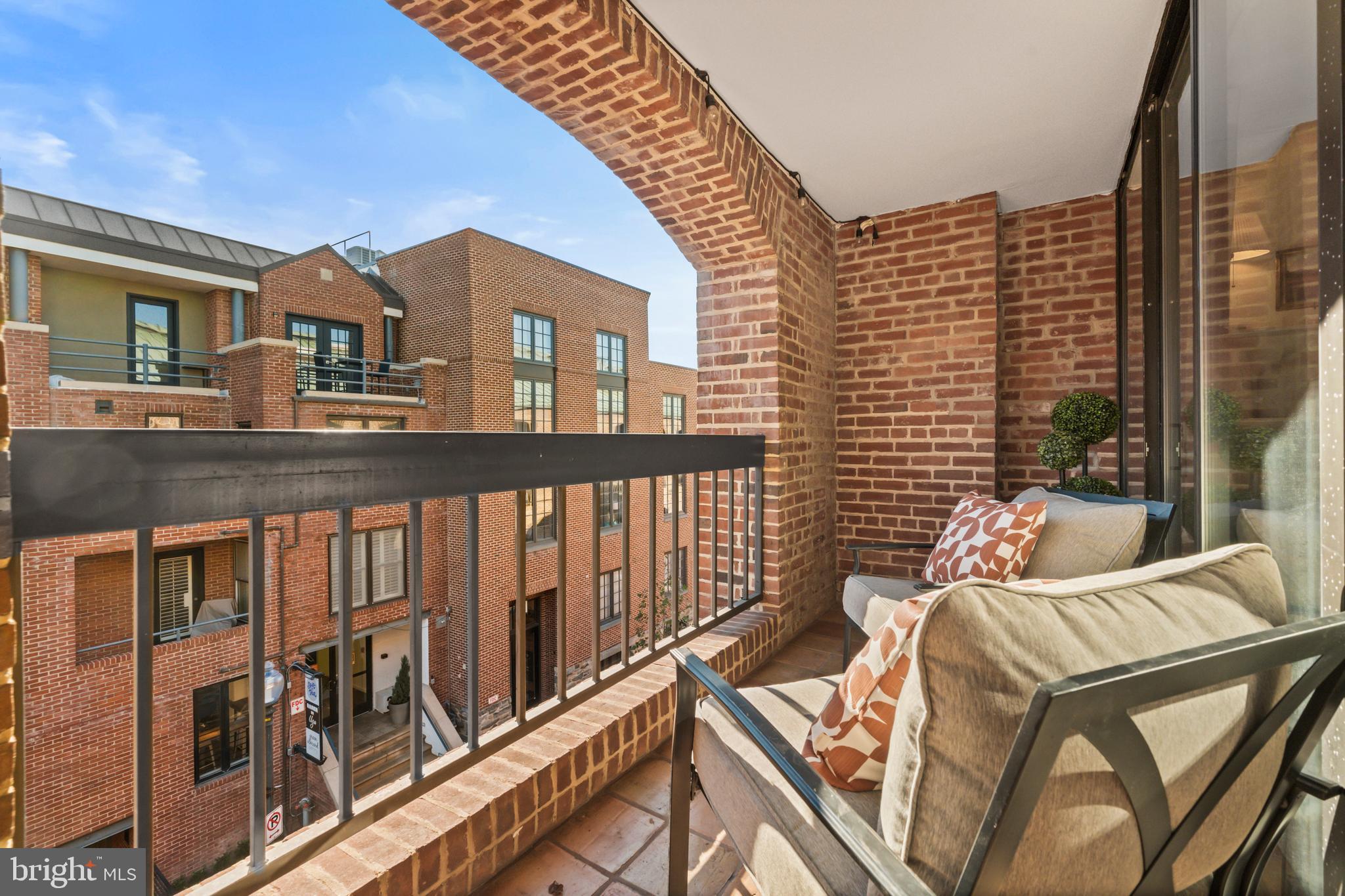 3225 Grace Street Northwest, Unit 219 Washington, DC 20007 - Photo 11 of 45 a balcony view with a large window and balcony
