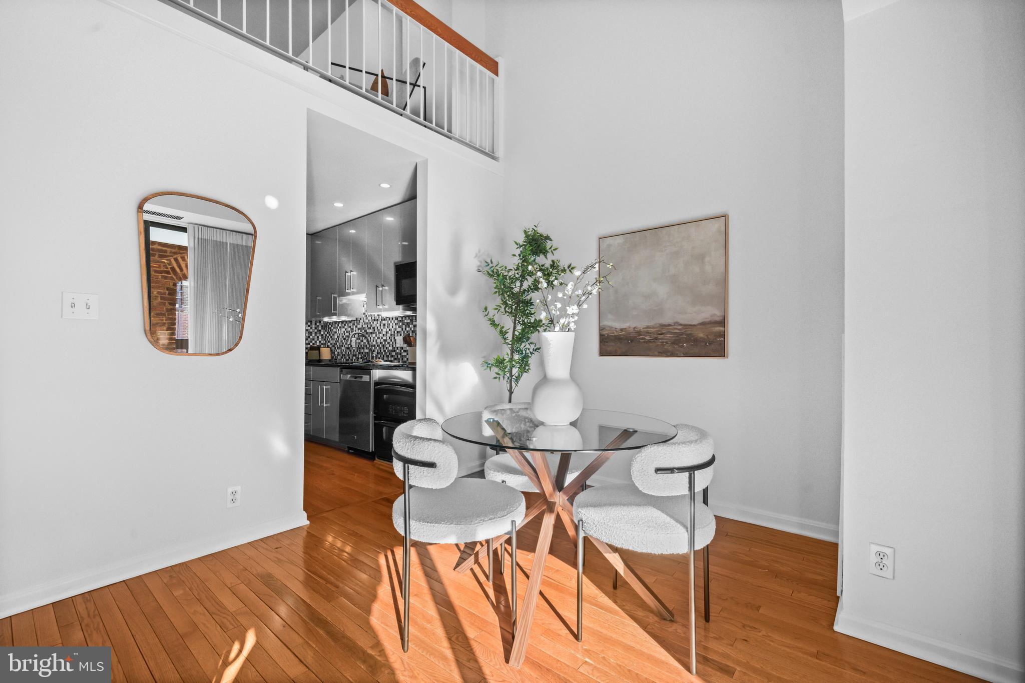 3225 Grace Street Northwest, Unit 219 Washington, DC 20007 - Photo 14 of 45 a view of a dining room with furniture and wooden floor