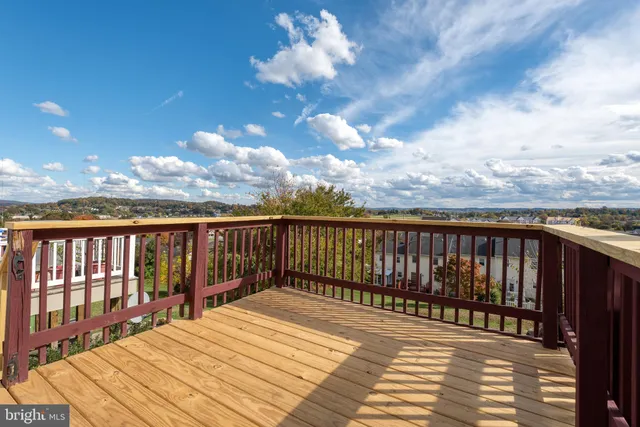 a view of balcony with wooden floor