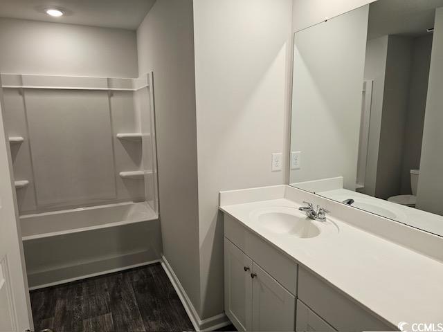 454 Ladyfish Loop Northwest Sunset Beach, NC 28468 - Photo 10 of 17 Bathroom with vanity, toilet, bathtub / shower com