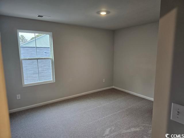 454 Ladyfish Loop Northwest Sunset Beach, NC 28468 - Photo 11 of 17 Unfurnished room featuring baseboards, visible ven