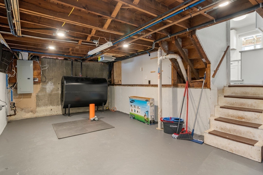 356 Central Street Framingham, MA 01701 - Photo 17 of 25 a view of storage and utility room with stairs