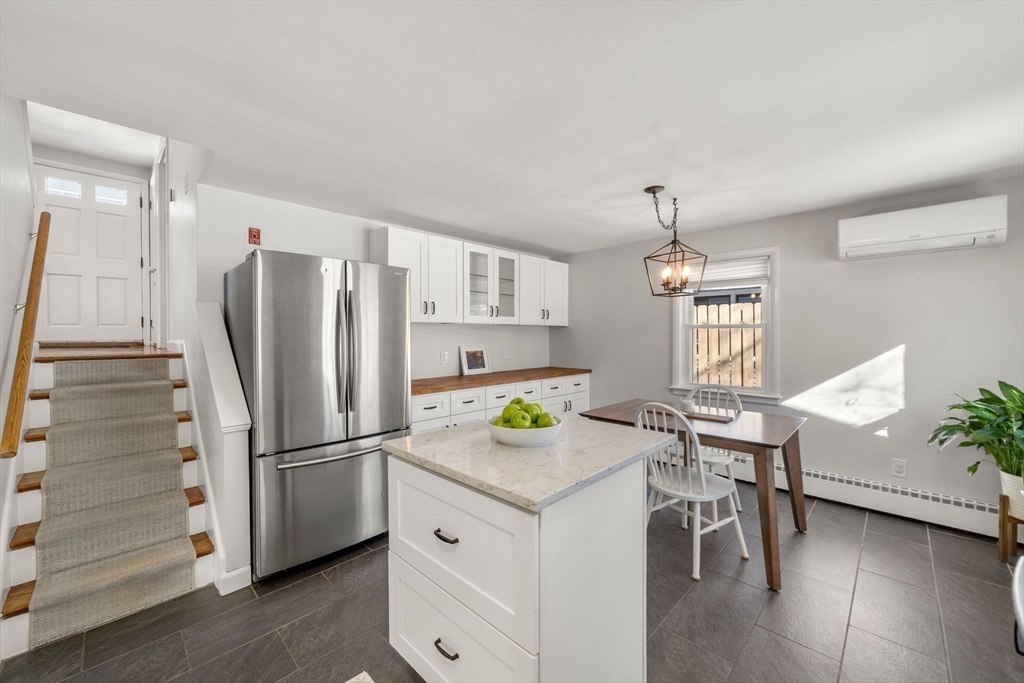 356 Central Street Framingham, MA 01701 - Photo 3 of 25 a kitchen with stainless steel appliances granite countertop a refrigerator and a stove top oven
