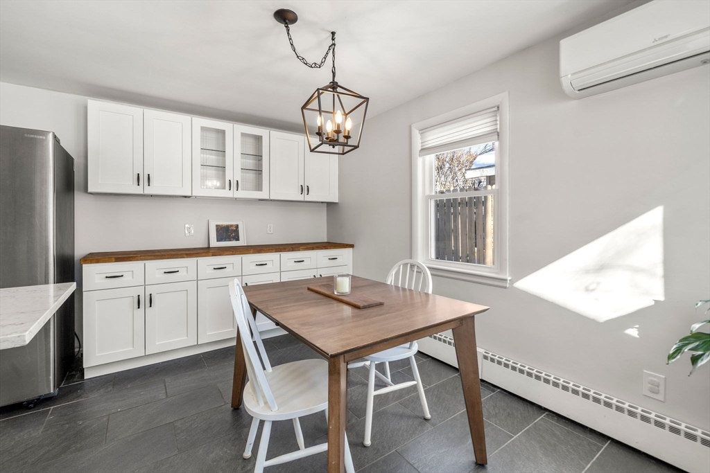356 Central Street Framingham, MA 01701 - Photo 4 of 25 a kitchen with cabinets table and chairs