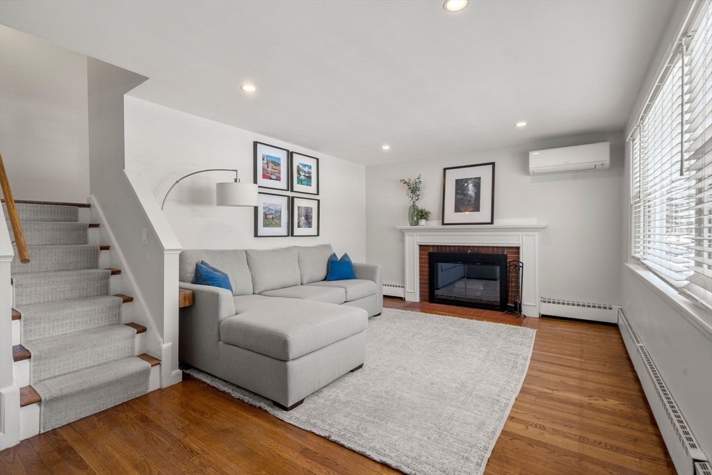 356 Central Street Framingham, MA 01701 - Photo 7 of 25 a living room with furniture and a fireplace