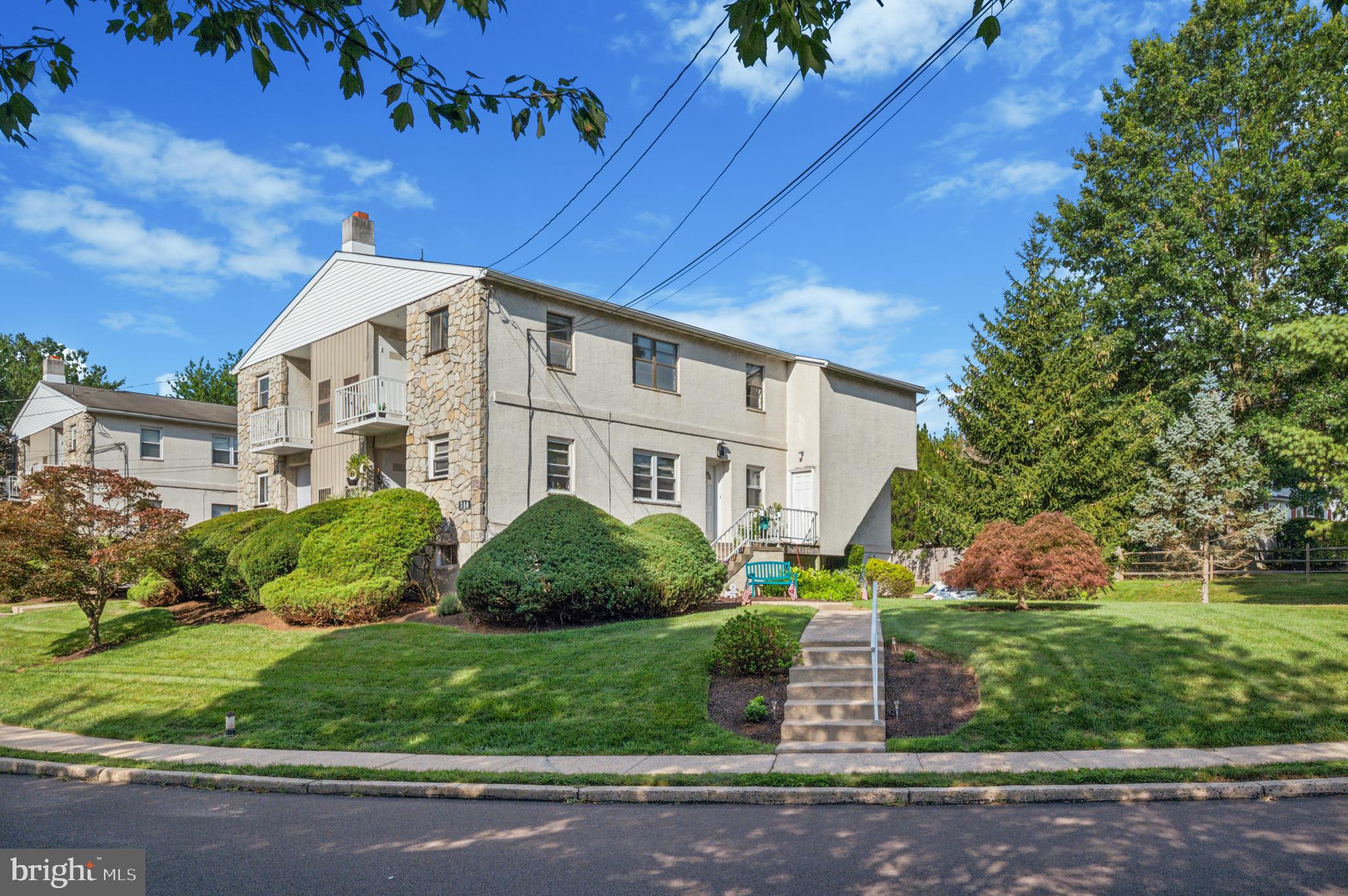 710 Willow Street, Unit B Lansdale, PA 19446 - Photo 1 of 25 a front view of a house with a yard