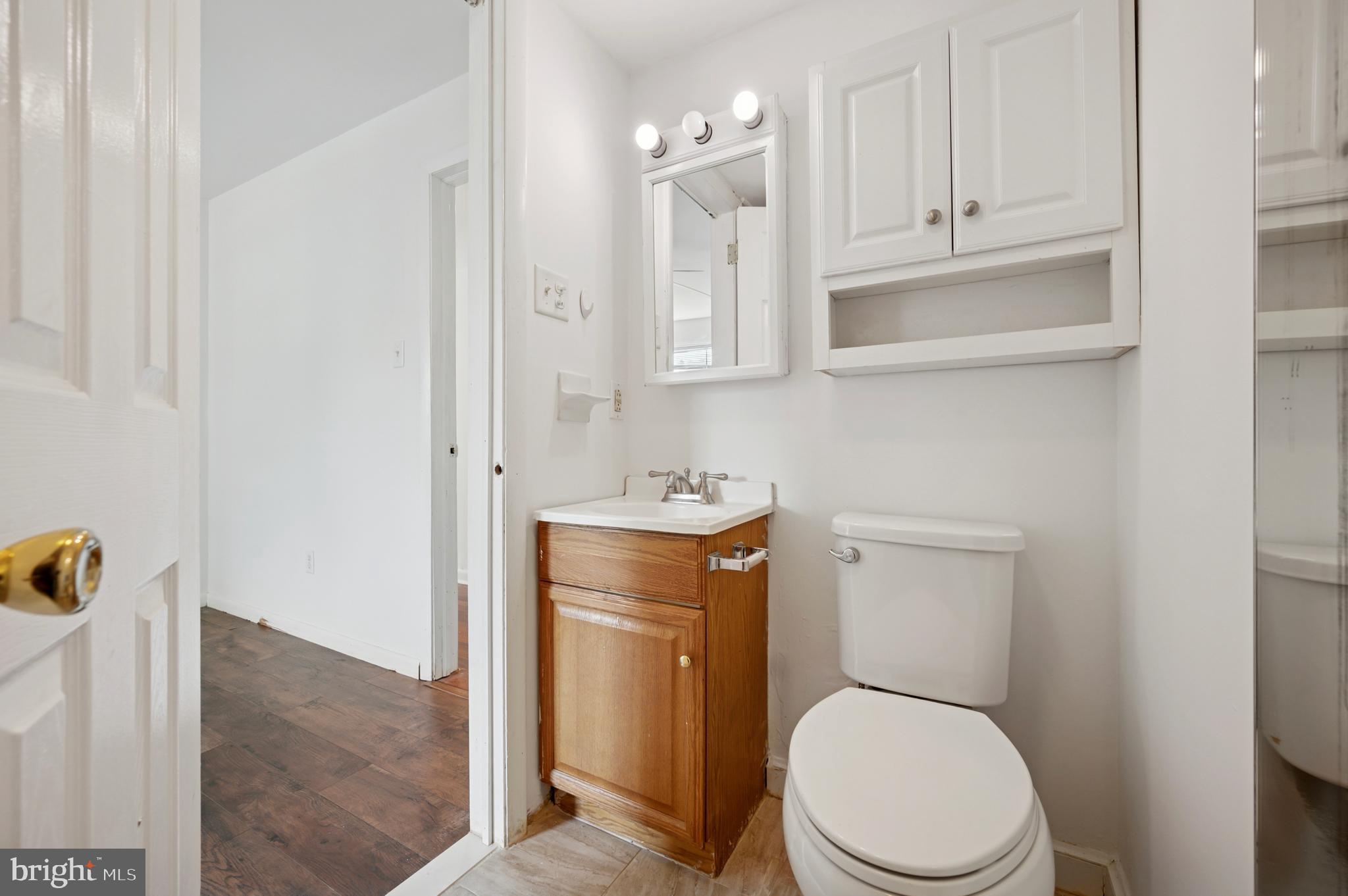 710 Willow Street, Unit B Lansdale, PA 19446 - Photo 12 of 25 a white toilet sitting next to a bathroom sink