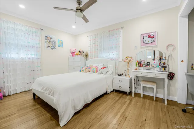 a bed room with a bed and a chair