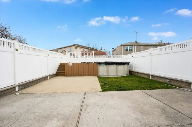 a view of a street with a building in the background