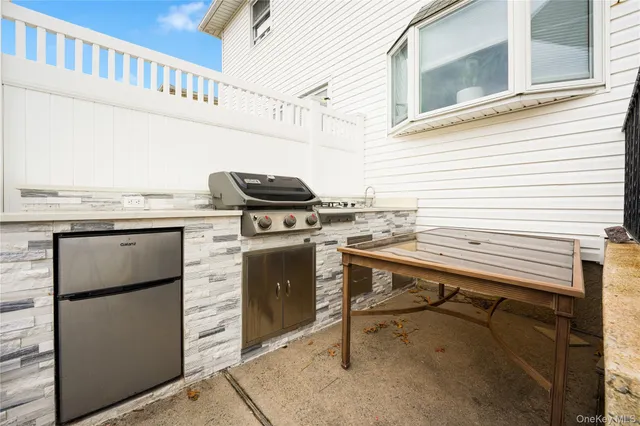 a view of a chairs with a kitchen