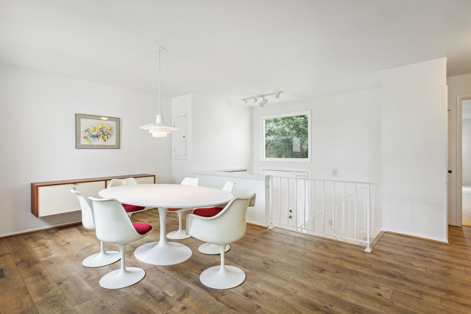 27 Fields East, Unit 27 Champaign, IL 61822 - Photo 12 of 35 a view of a dining room with furniture and wooden floor