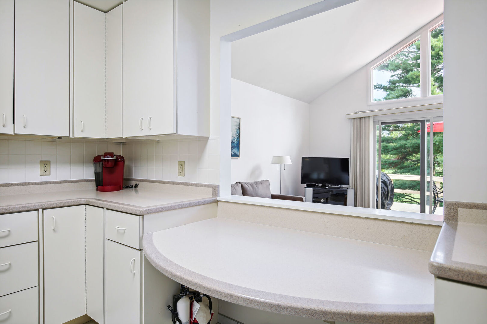 27 Fields East, Unit 27 Champaign, IL 61822 - Photo 15 of 35 a kitchen with stainless steel appliances a sink a stove and a window