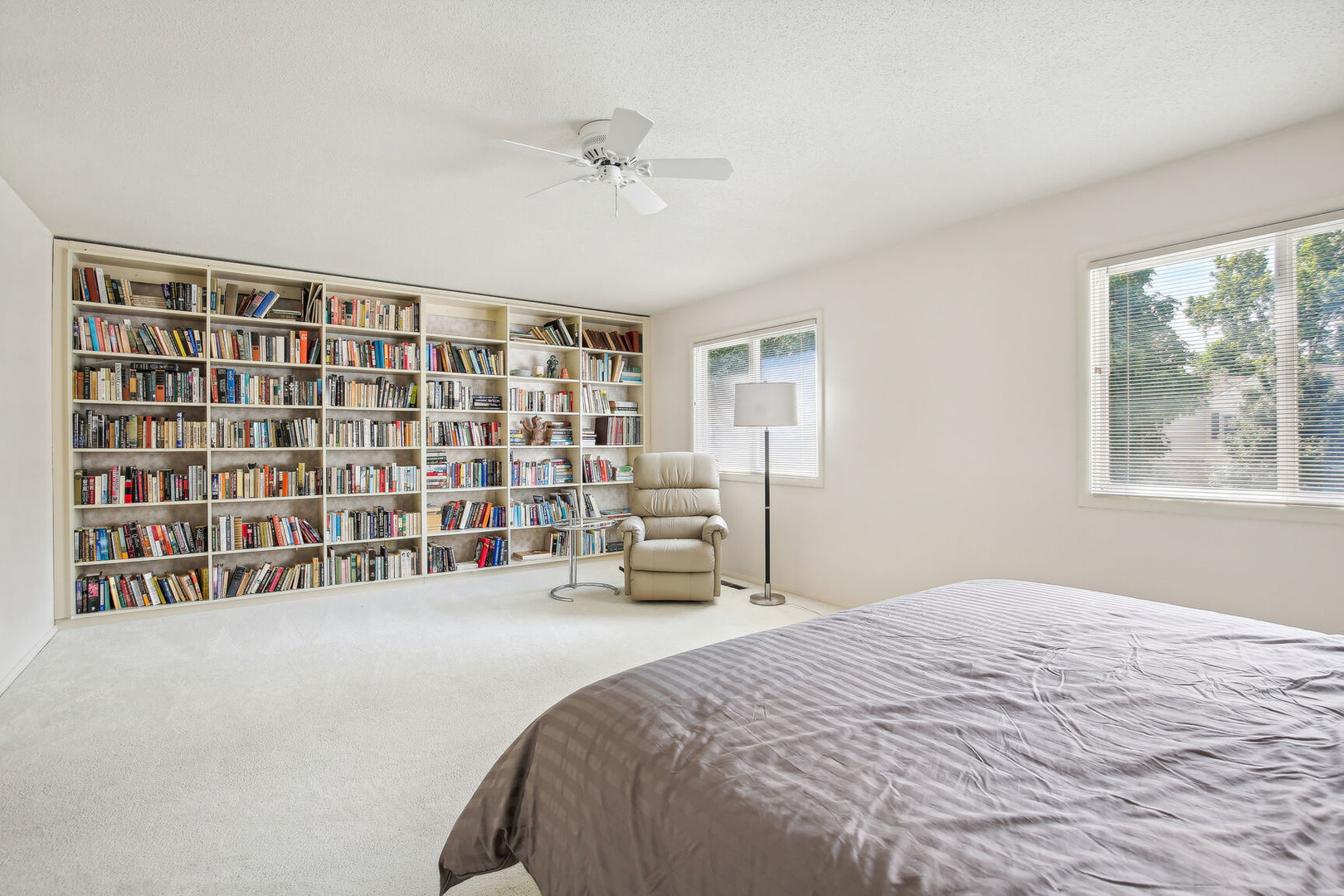 27 Fields East, Unit 27 Champaign, IL 61822 - Photo 17 of 35 a bedroom with a bed and a large window