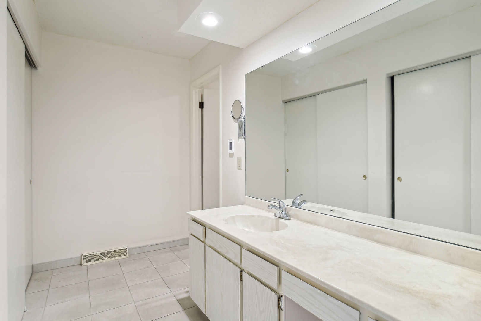 27 Fields East, Unit 27 Champaign, IL 61822 - Photo 19 of 35 a bathroom with a sink and a mirror