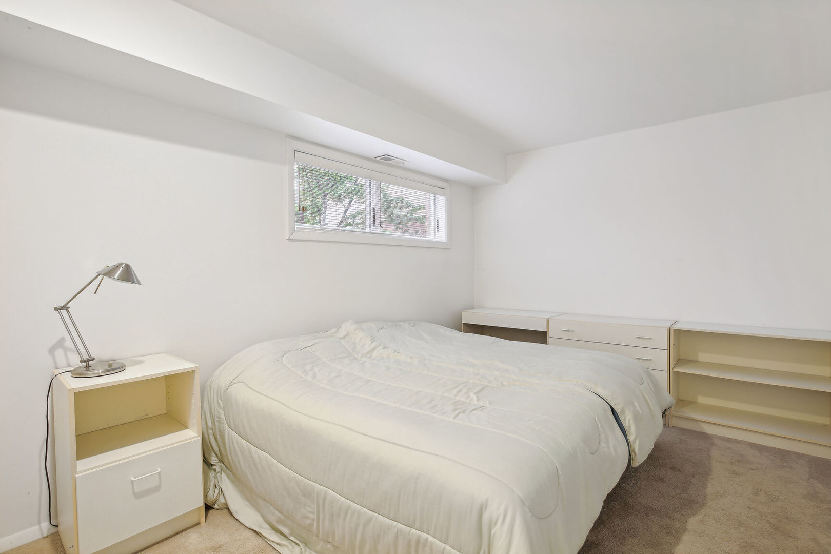 27 Fields East, Unit 27 Champaign, IL 61822 - Photo 22 of 35 a bedroom with a bed and a window