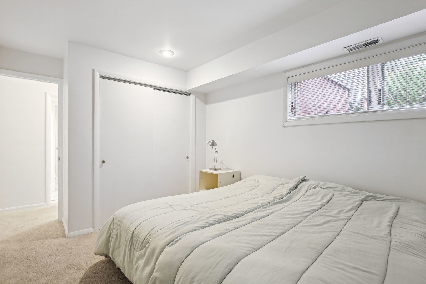 27 Fields East, Unit 27 Champaign, IL 61822 - Photo 23 of 35 a bedroom with a bed and a window