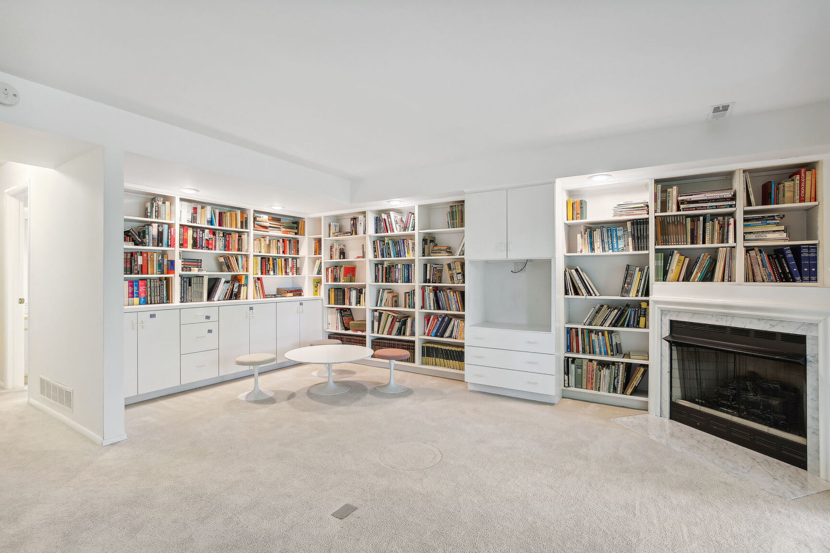 27 Fields East, Unit 27 Champaign, IL 61822 - Photo 24 of 35 an empty room with furniture and a fireplace